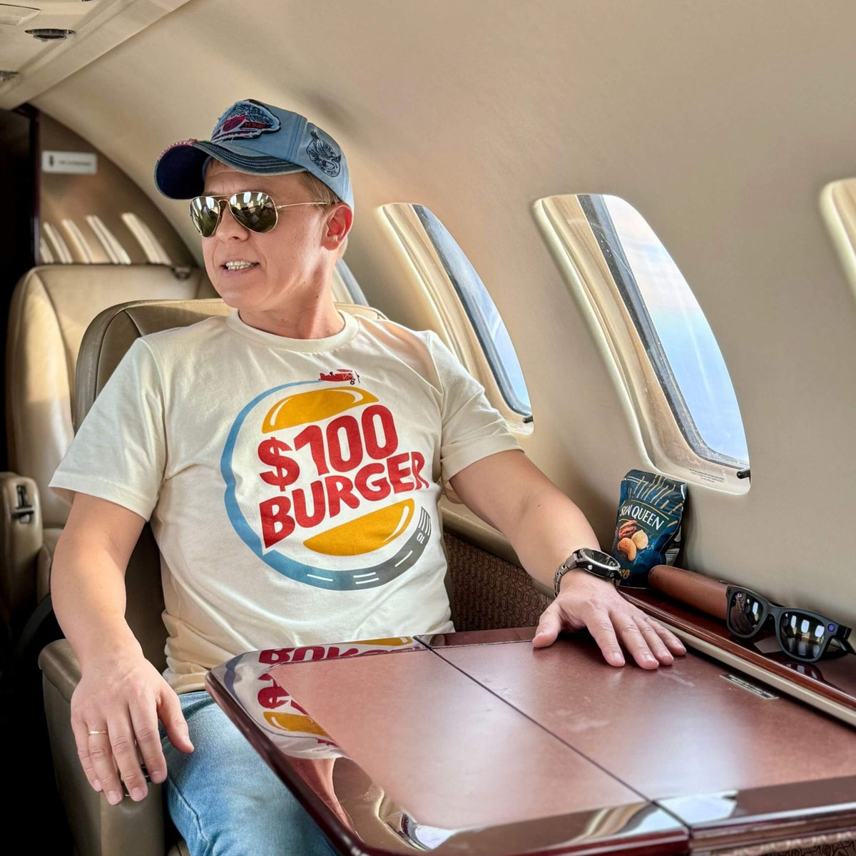 Woman wearing a $100 Burger aviation T-shirt
