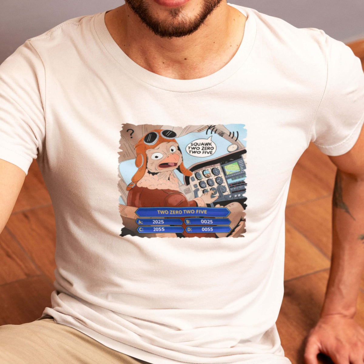 Man wearing a white aviation comic T-shirt