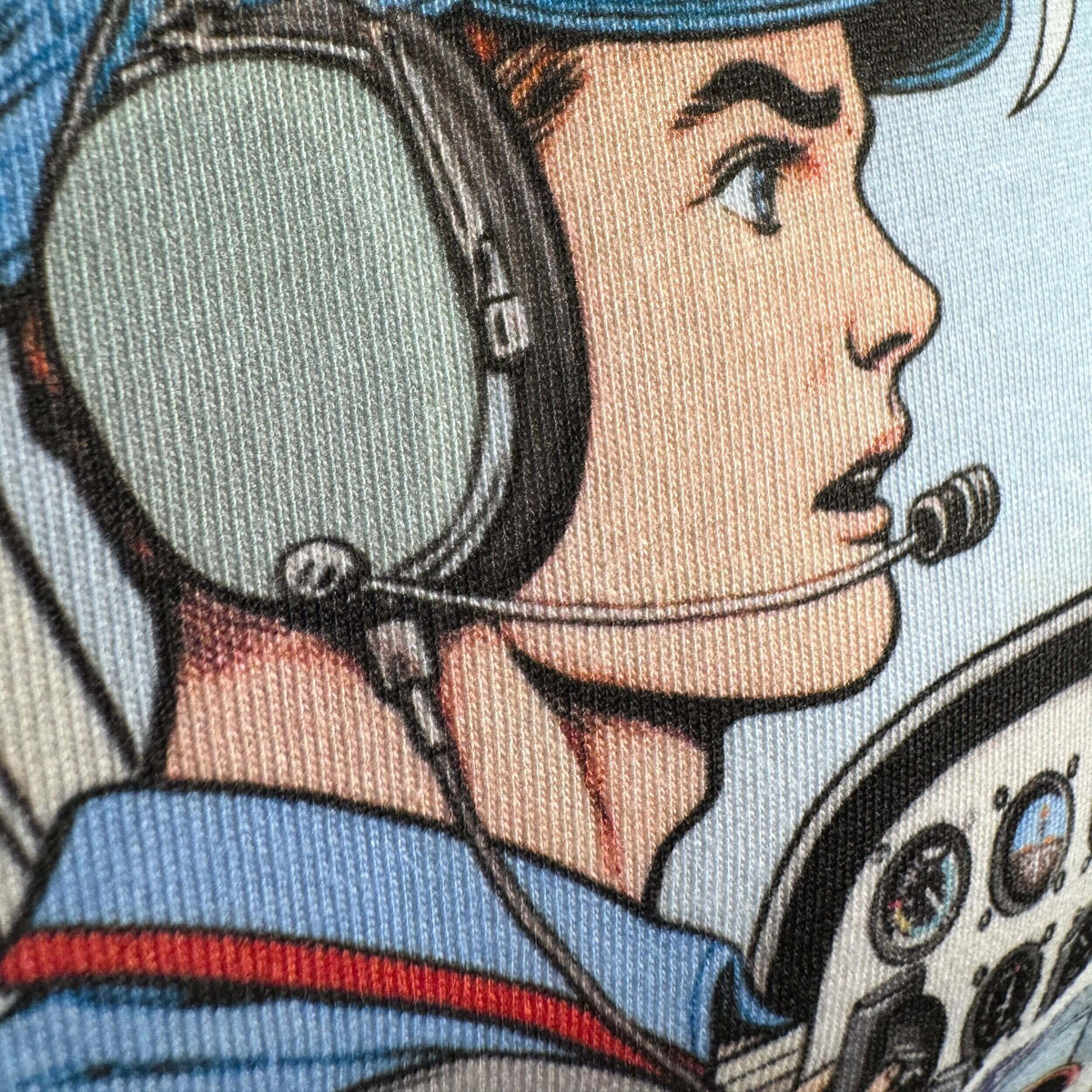Close-up of The Noise aviation comic print on T-shirt fabric