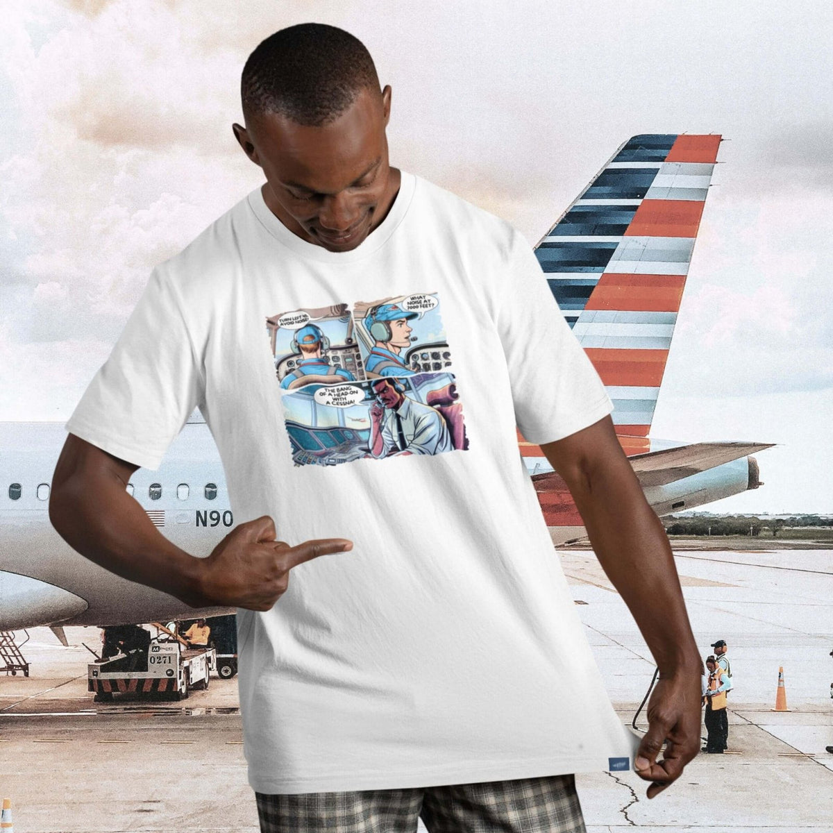 Man wearing The Noise aviation comic T-shirt beside an airplane