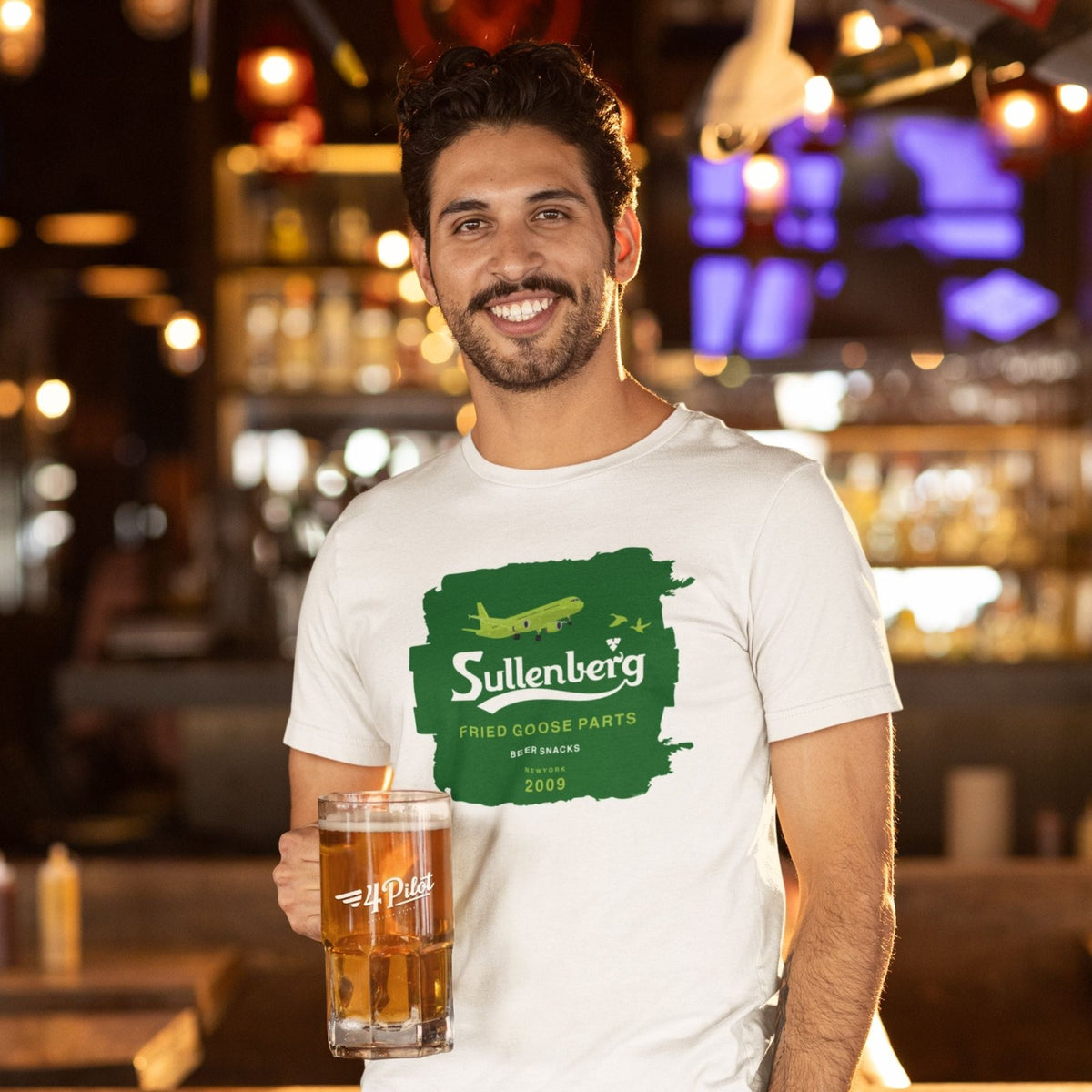 Man wearing a white Sullenberg aviation T-shirt