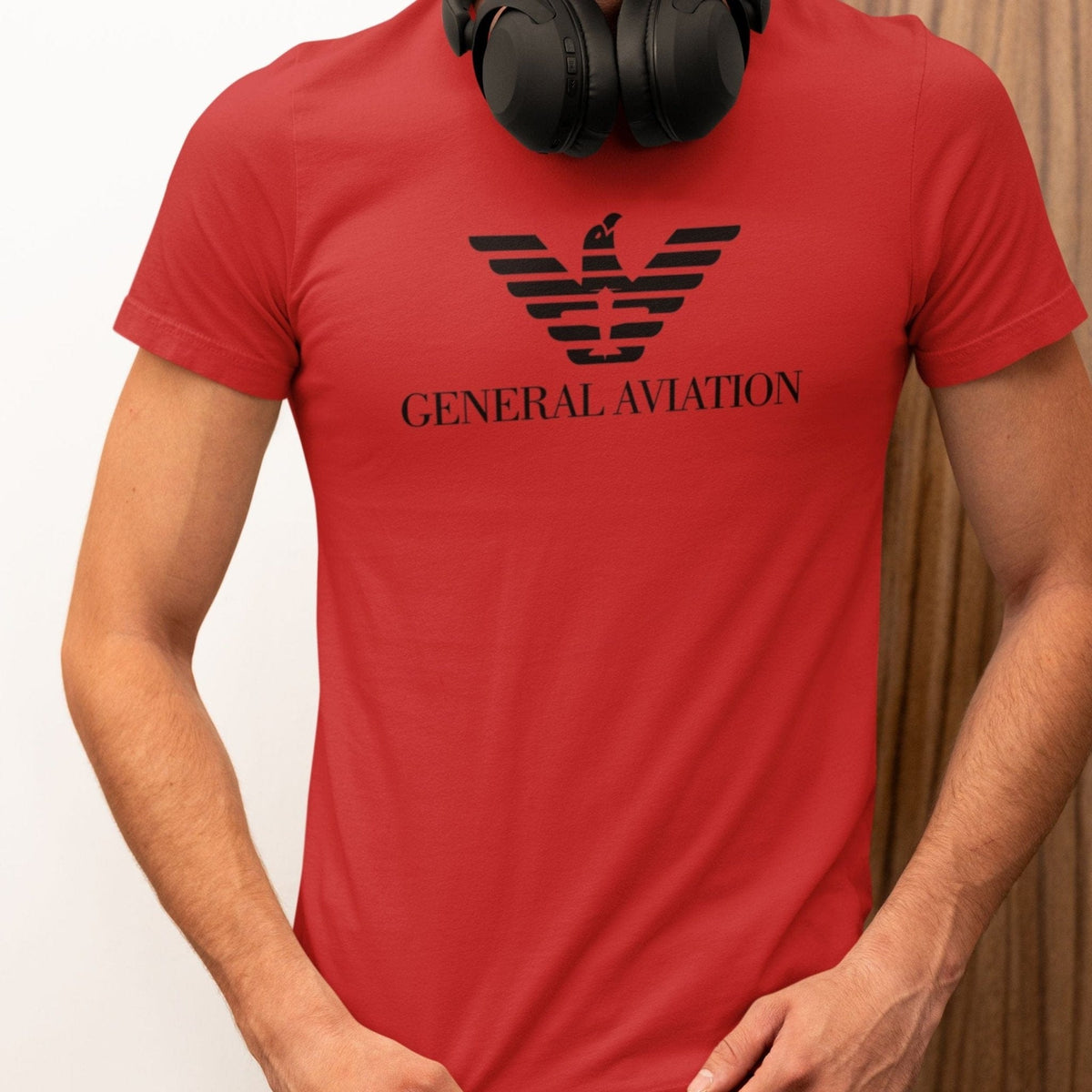 Man wearing a red General Aviation logo parody T-shirt