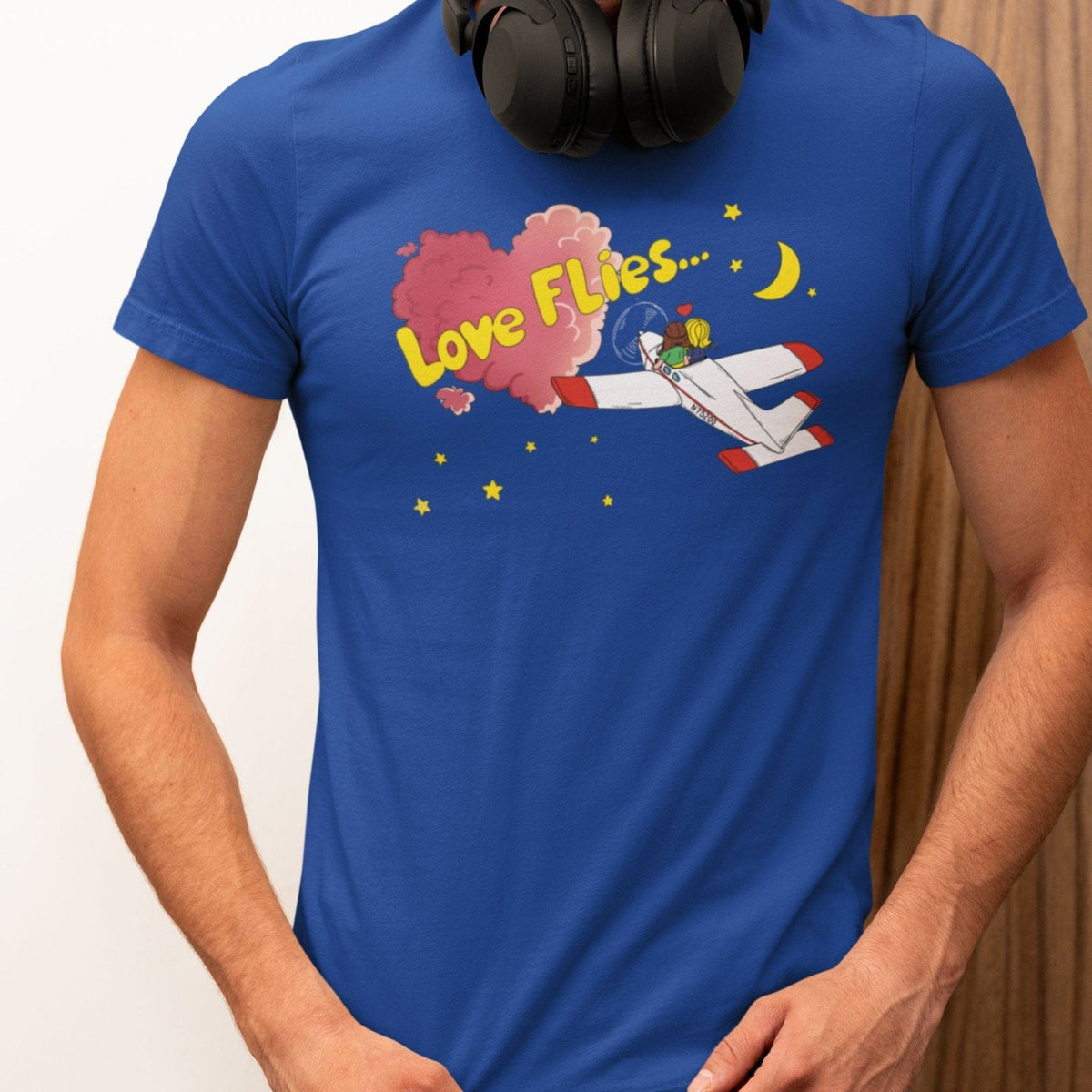 Man wearing a blue Love Flies pilot T-shirt