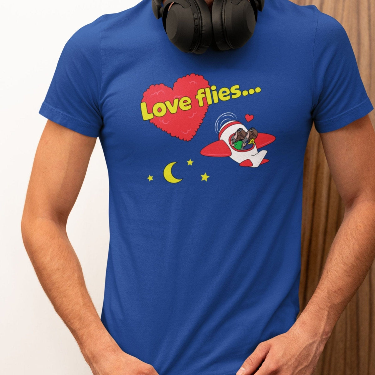 Man wearing a blue Love Flies V2 pilot T-shirt