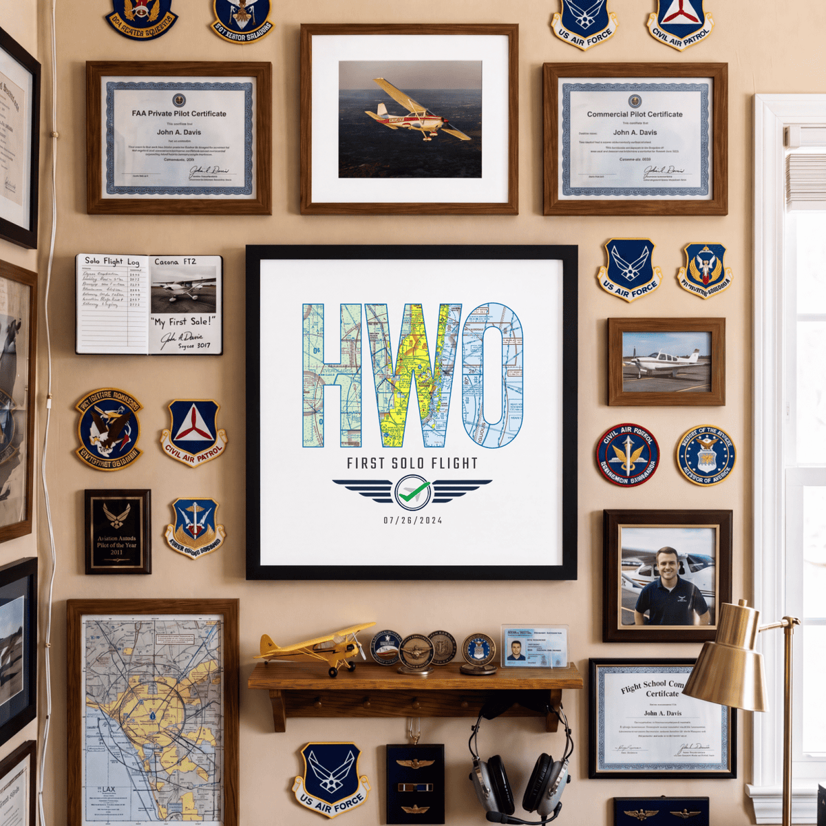 Black-framed HWO First Solo Flight print displayed among aviation certificates and memorabilia