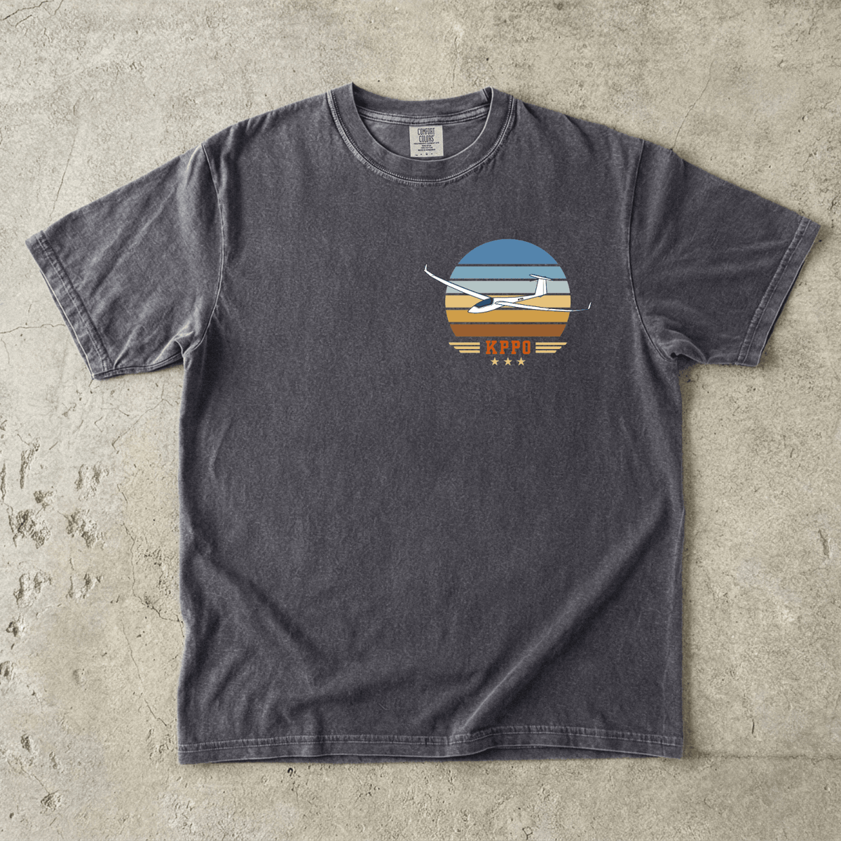 Gray Vintage Attitude T-shirt laid flat with a glider and airport code in a retro striped design
