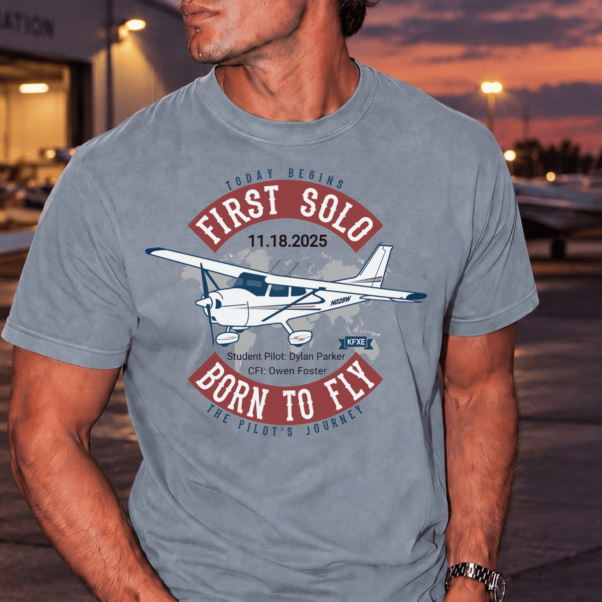 Man wearing a gray First Solo T-shirt with red lettering, a high-wing airplane, and personalized names