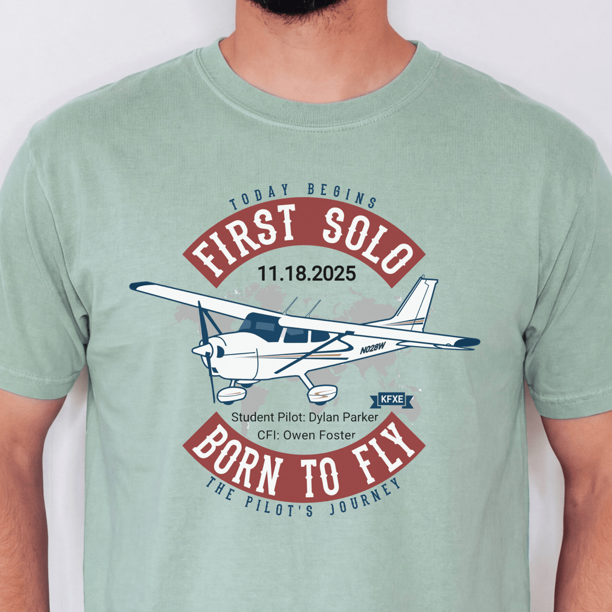 Light green First Solo T-shirt with a high-wing airplane illustration and personalized flight details