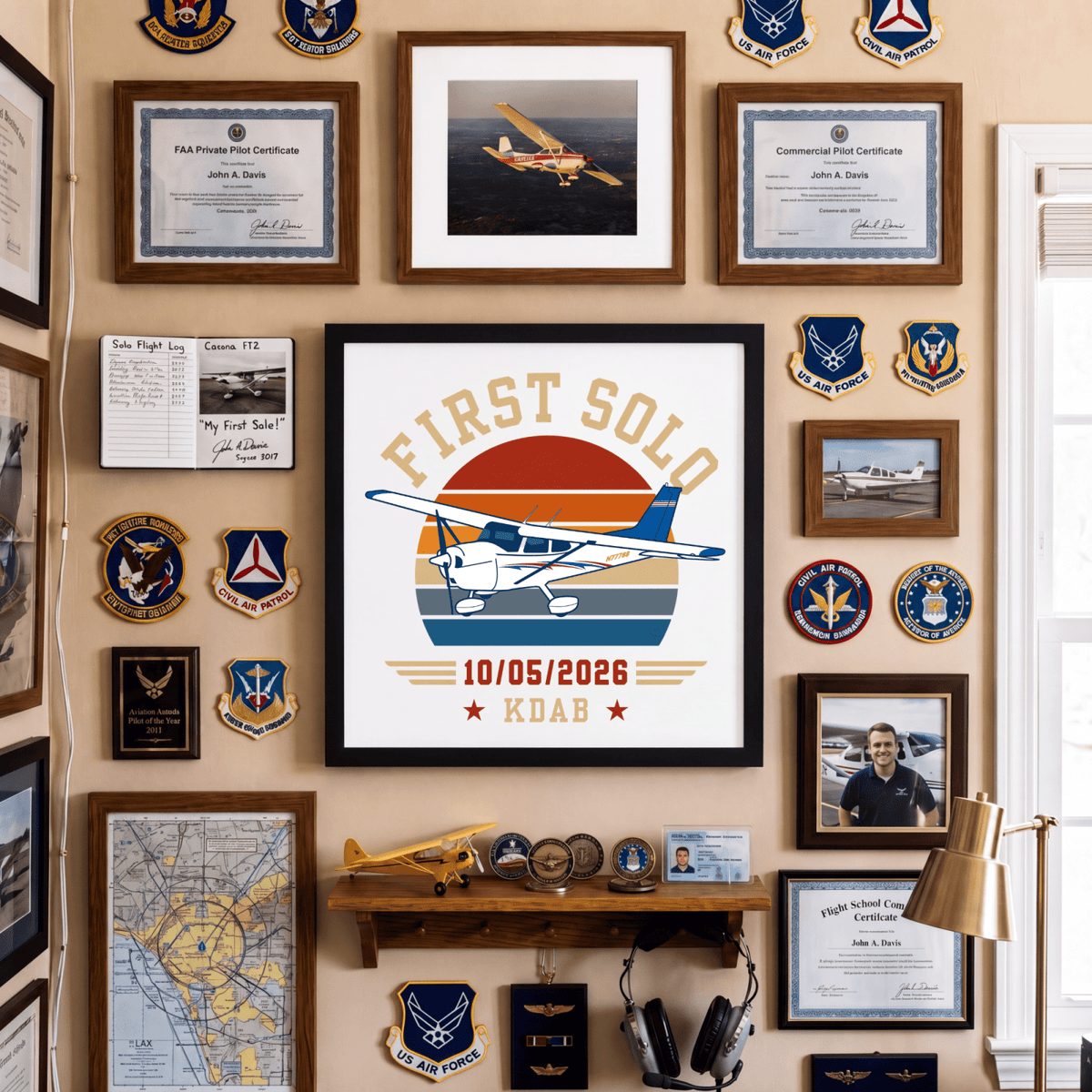Personalized first solo flight print displayed among aviation certificates and patches