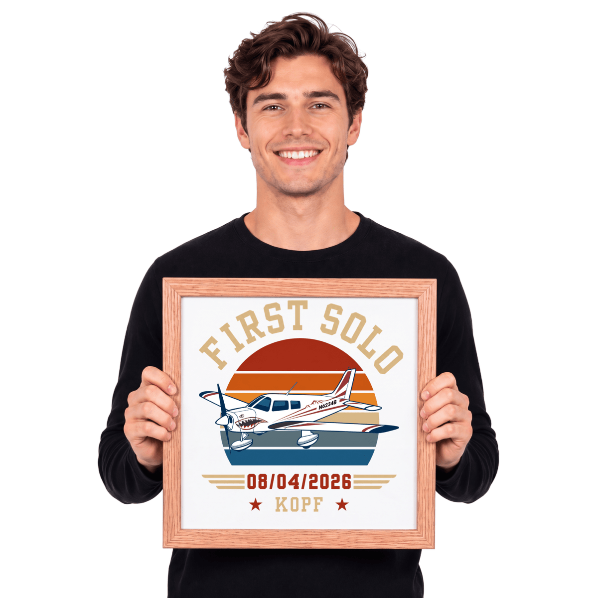 Man holding a personalized first solo aircraft print in a wood frame