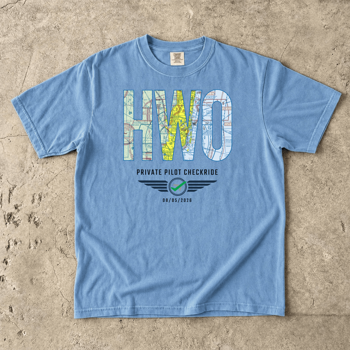 Blue HWO airport code VFR chart T-shirt laid flat, personalized with a private pilot checkride date